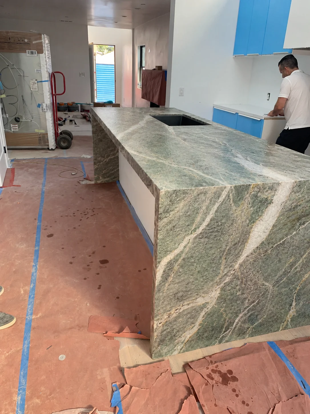Dekton Kaira waterfall island with integrated sink cutout in a Los Angeles kitchen