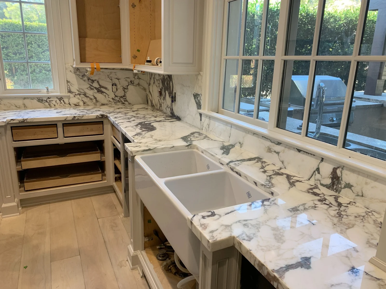 Calacatta Vagli kitchen counters with apron-front sink