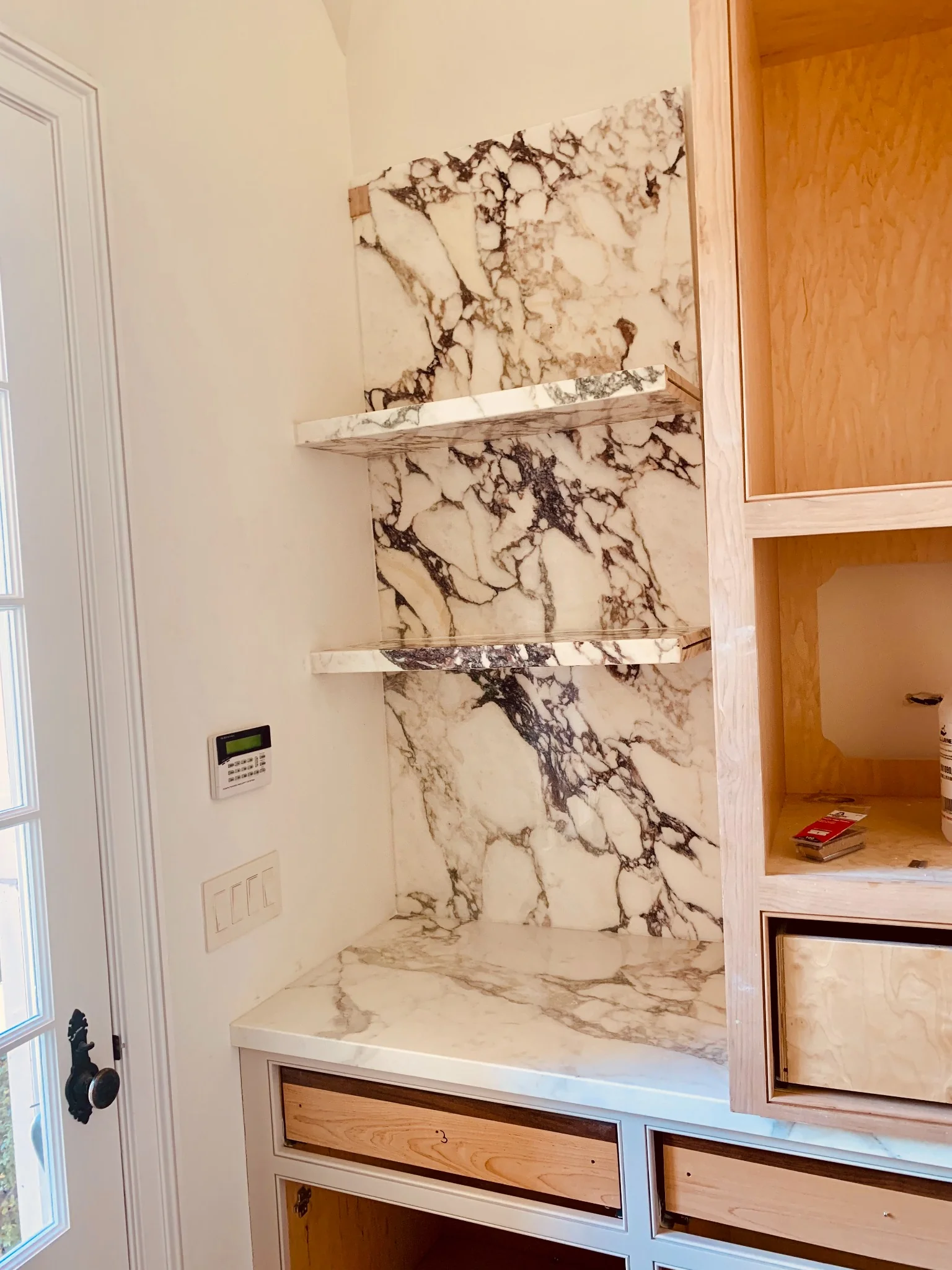 Calacatta Viola marble shelves and niche detail