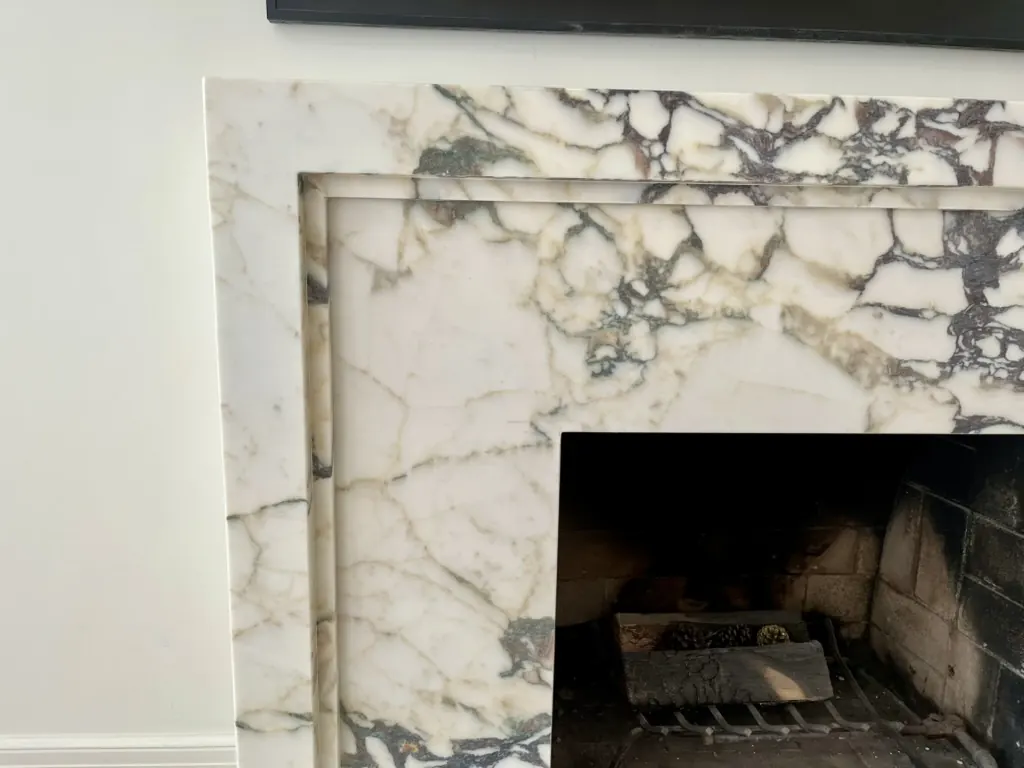 Close-up detail of custom stone fireplace surround