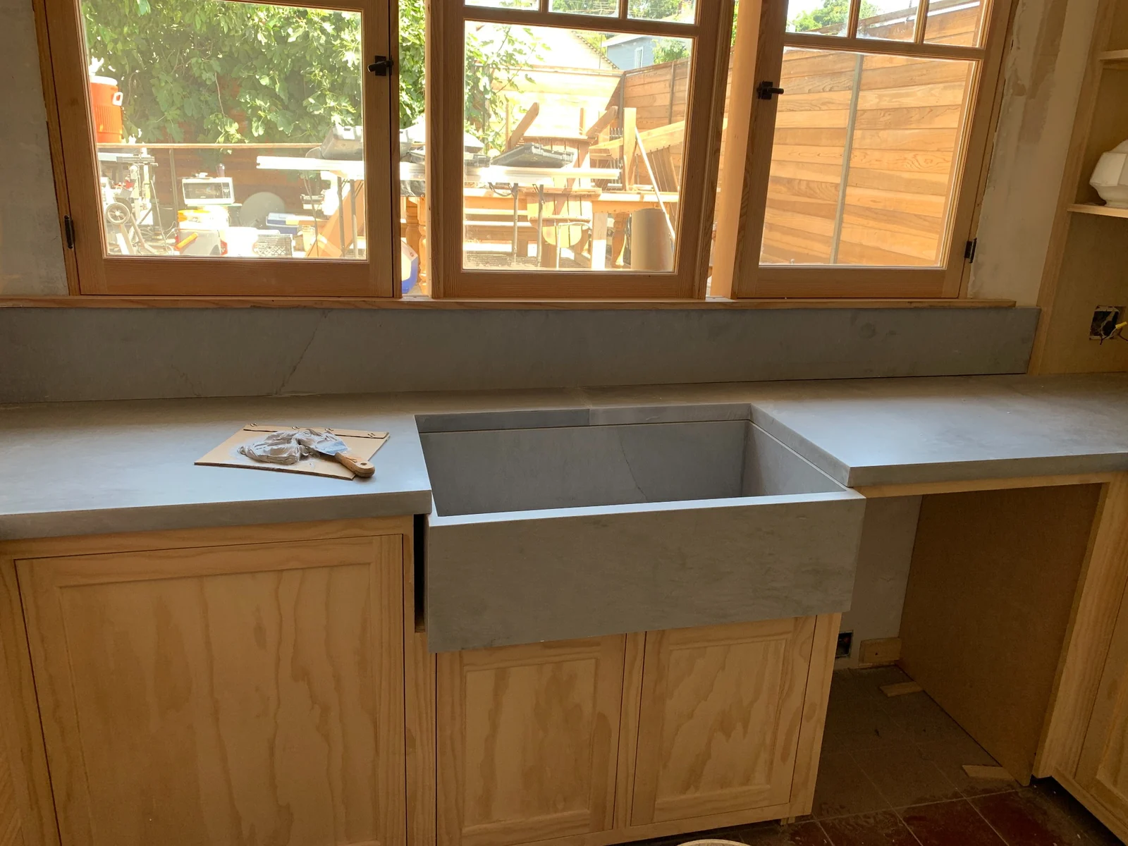 Honed limestone countertop with integrated farmhouse sink