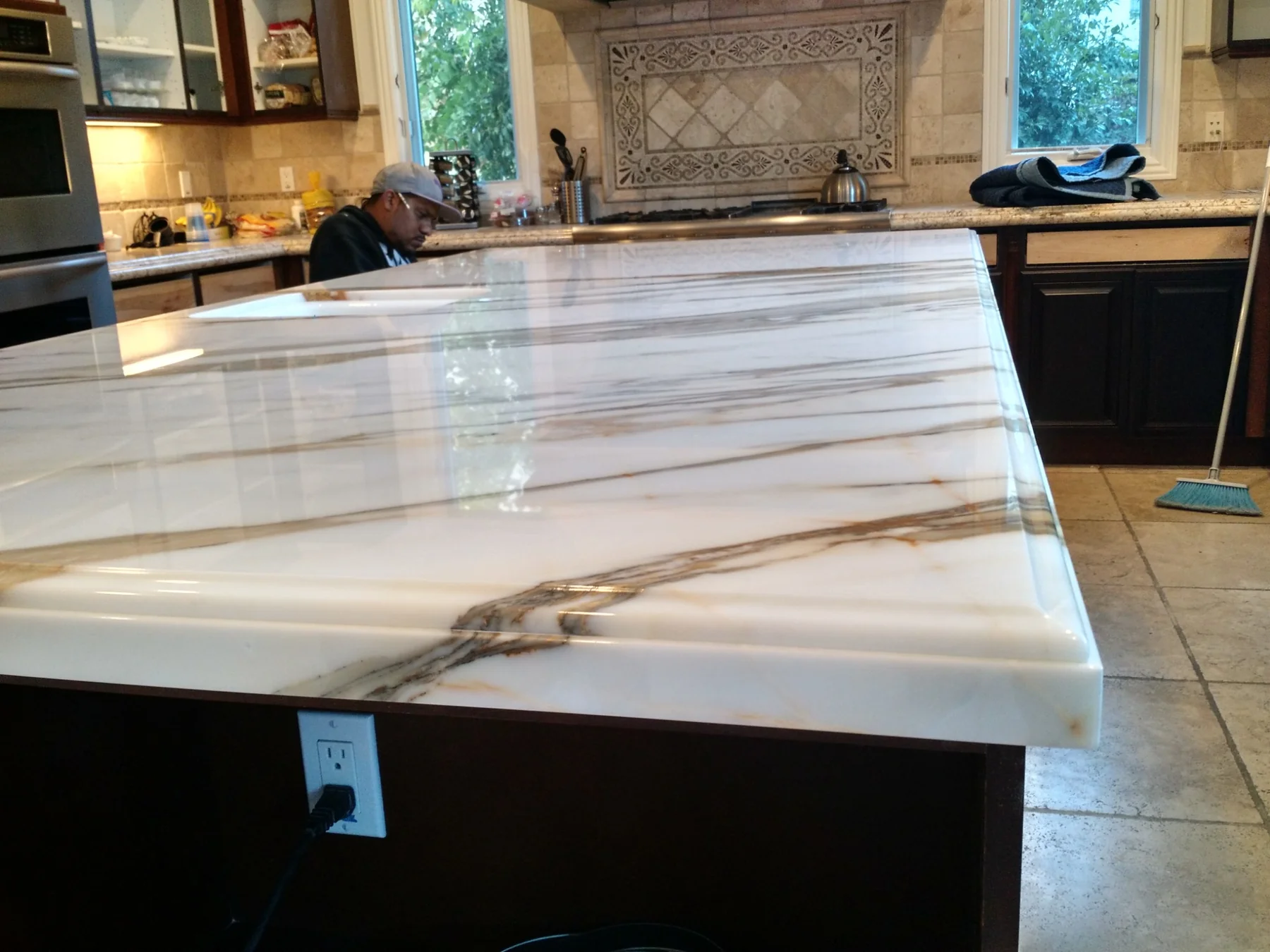 Calacatta linear-vein island with polished finish and integrated sink