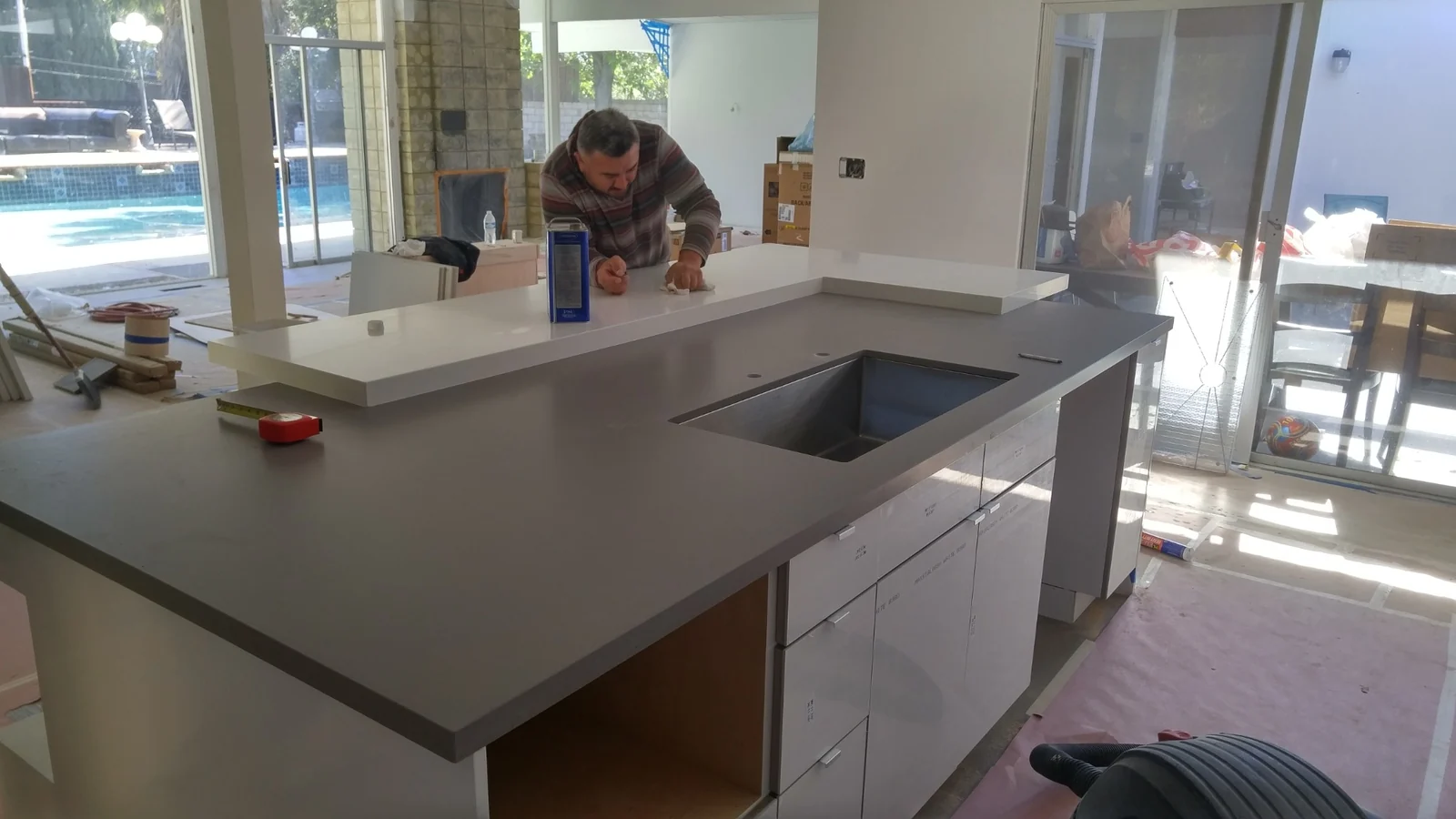 Silestone gray kitchen island with integrated sink cutout