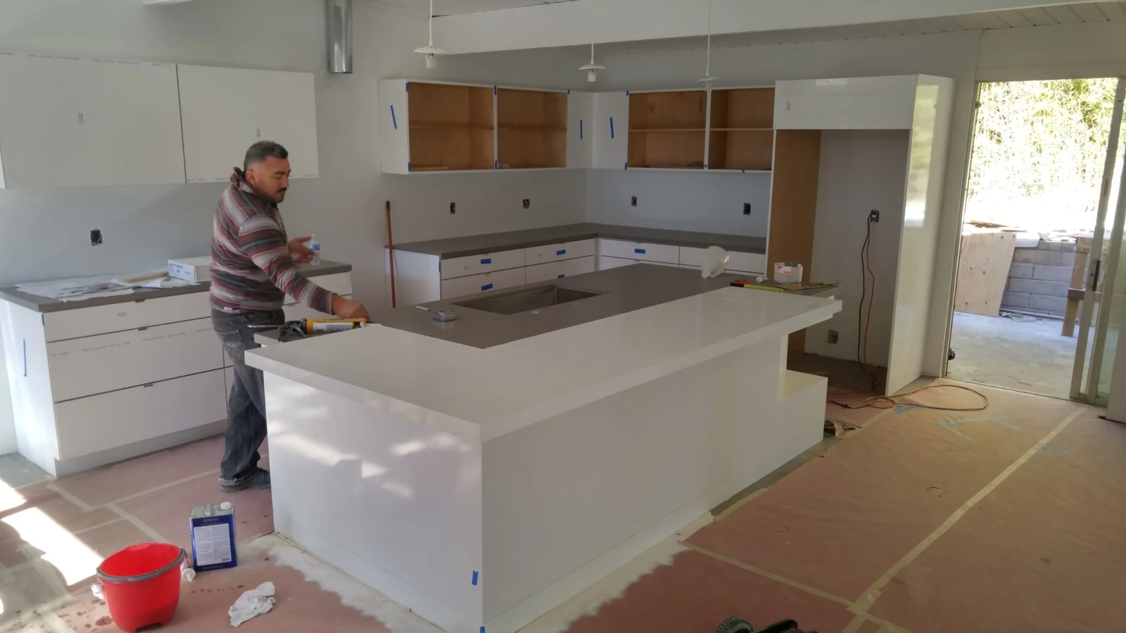 Silestone two-tone kitchen island with white and gray engineered stone surfaces