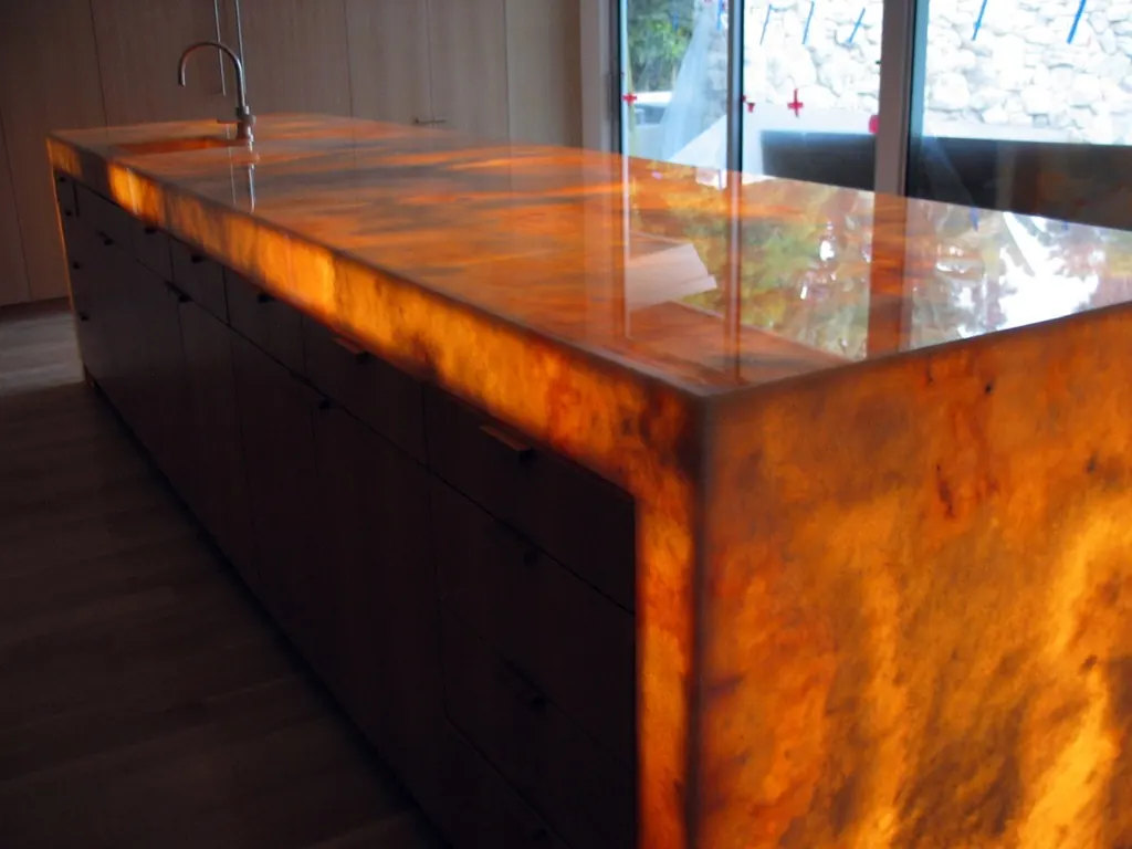 Backlit onyx waterfall island countertop