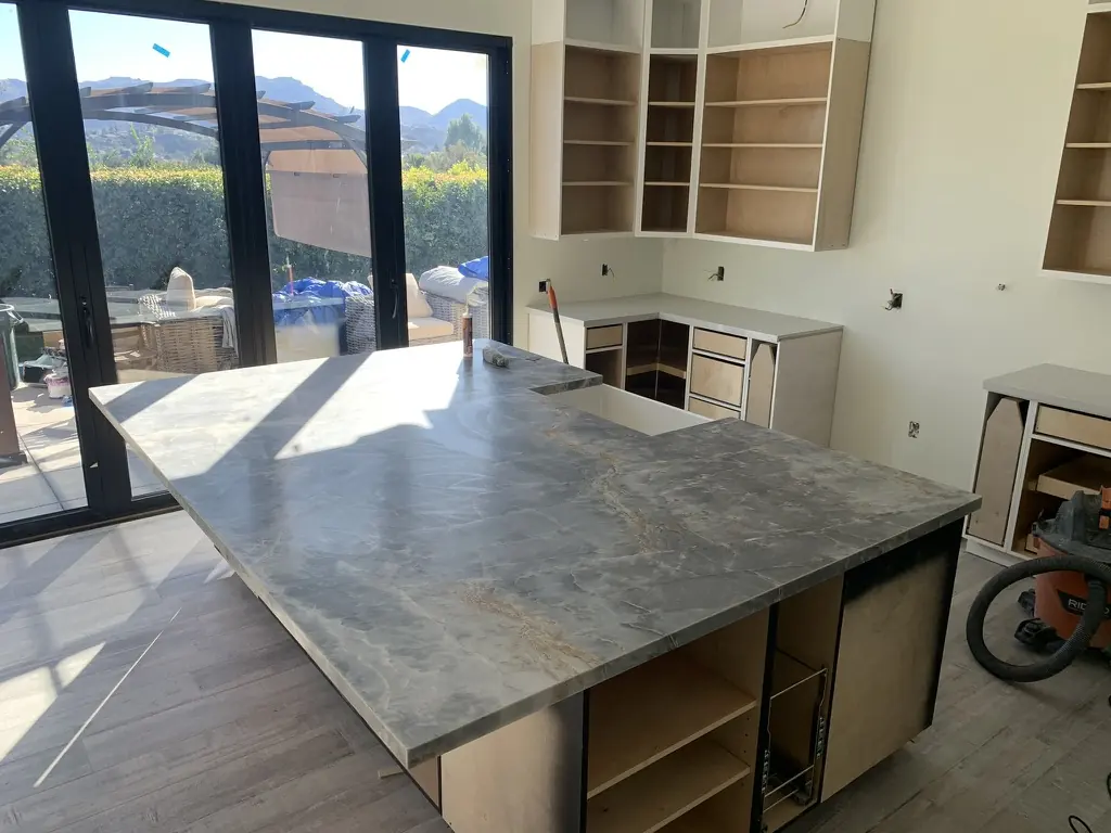 Custom grey stone kitchen island countertop installed in Los Angeles residence