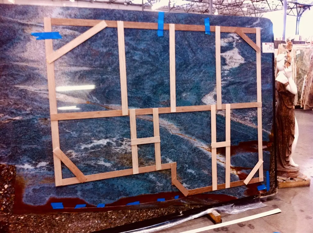 Stone slab template layout for custom fabrication at West Coast Custom Stonework in Sun Valley